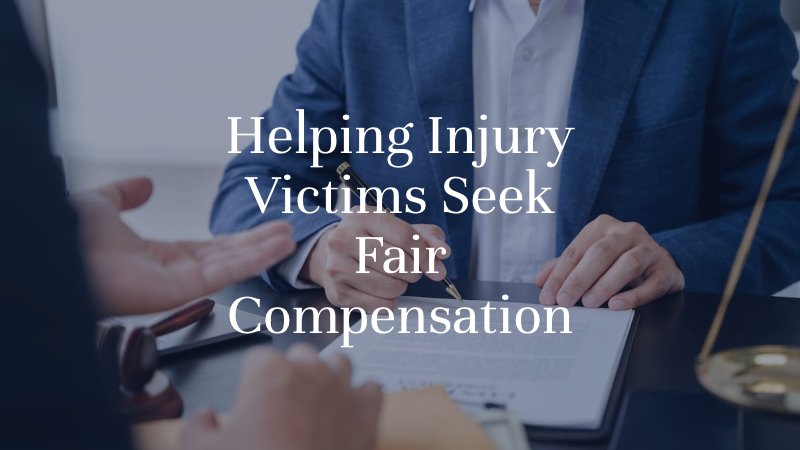 Personal injury attorney reviewing and signing legal documents with a client during a consultation in Oklahoma